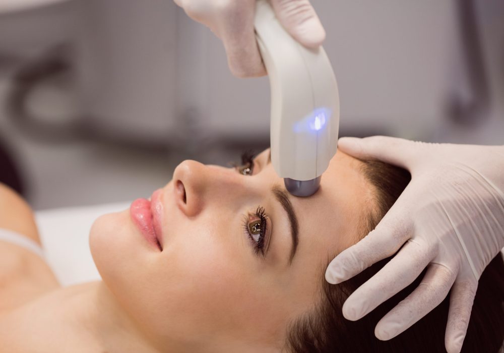 Female patient receiving cosmetic treatment at clinic